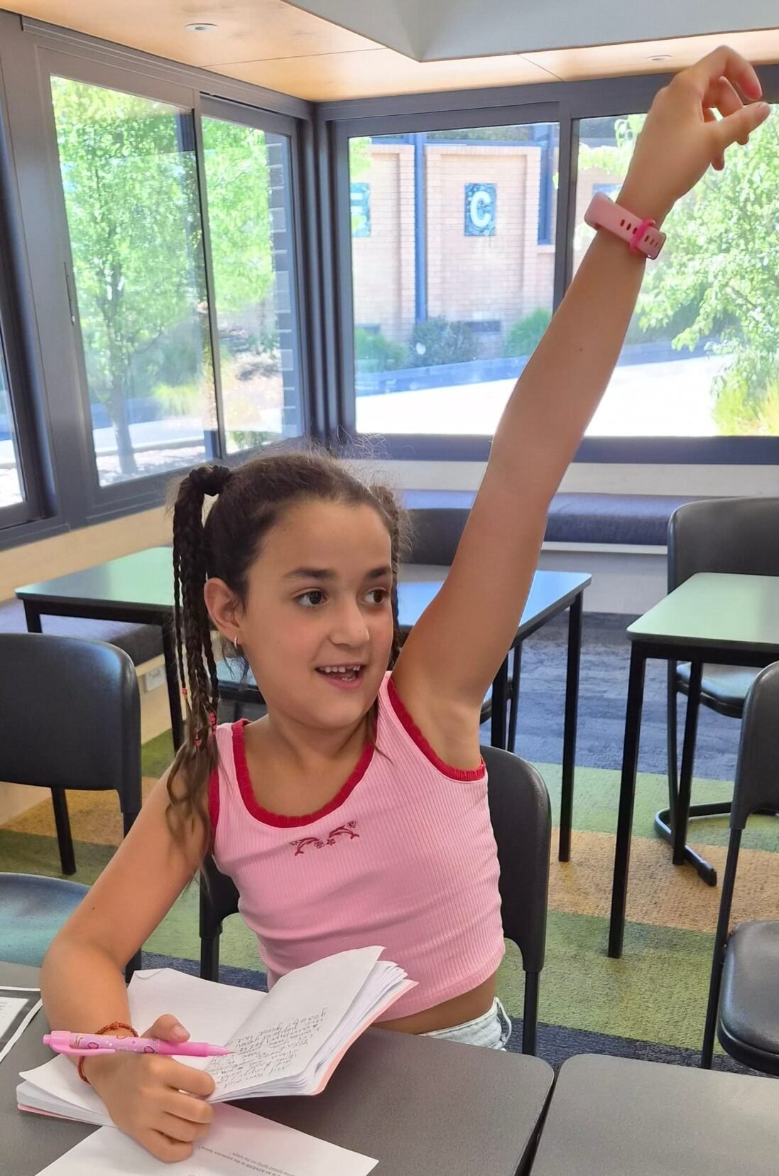 Student raising her hand during a NRICH Learning lesson