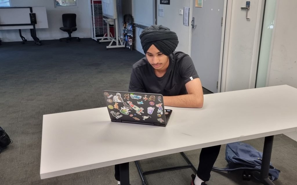 Student working on a laptop during a NRICH Learning session