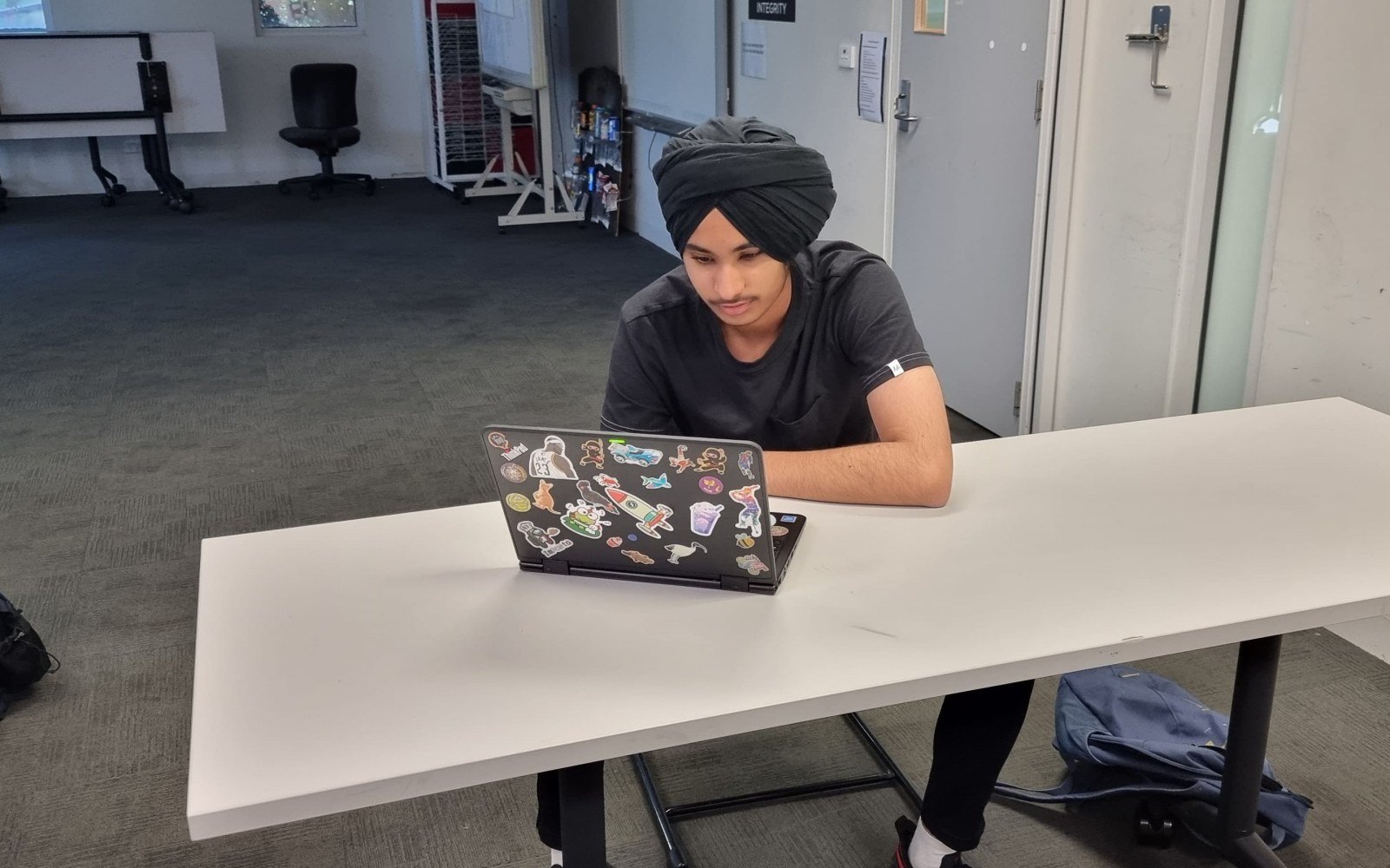 Student working on a laptop during a NRICH Learning session